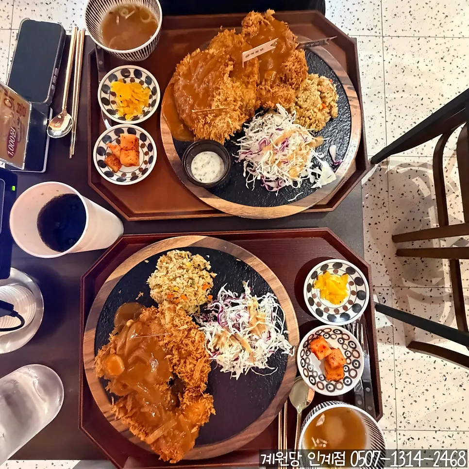Generous chicken cutlet spread ordered by two people
