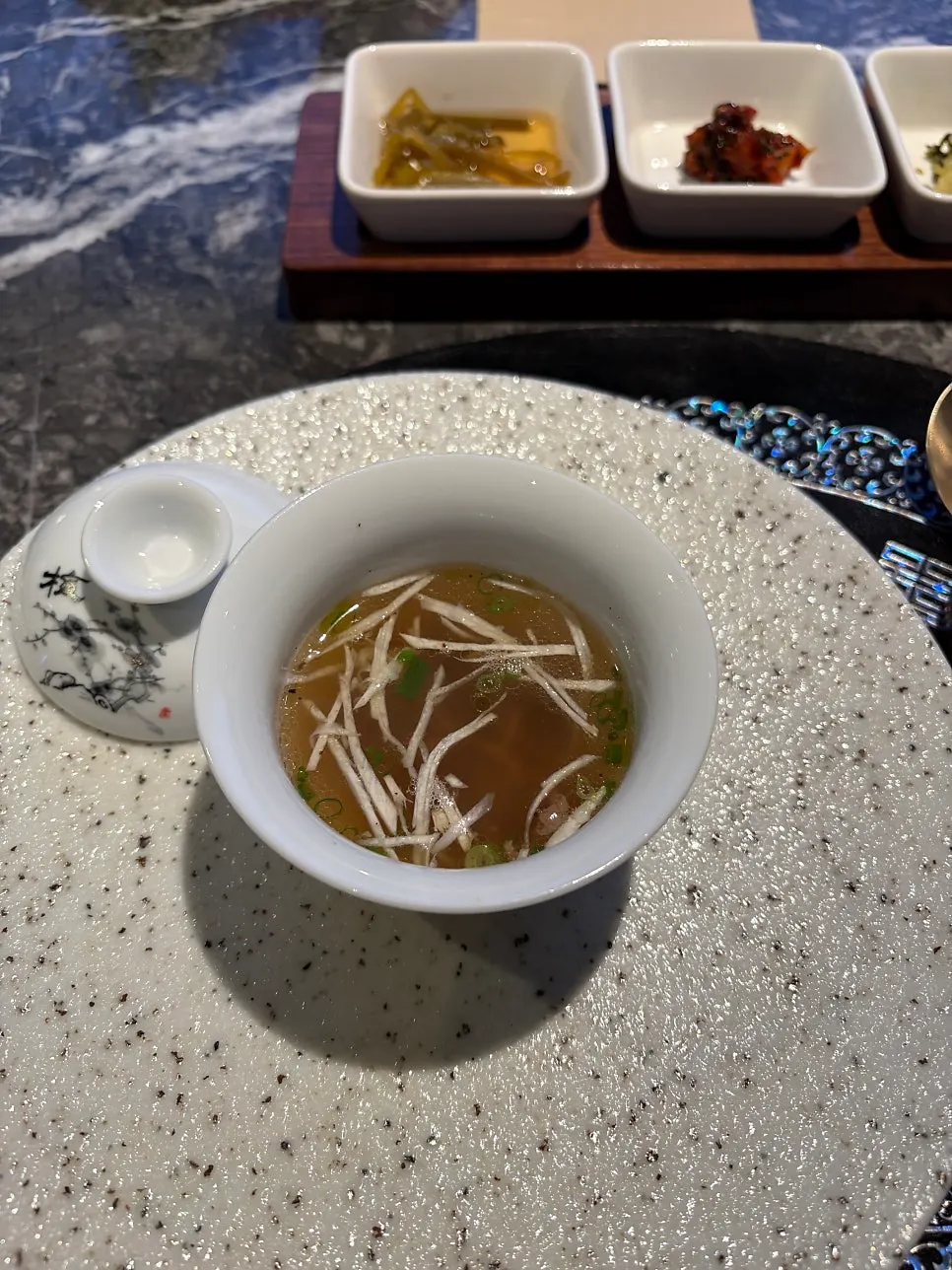 Warm gomtang served at the start of the course