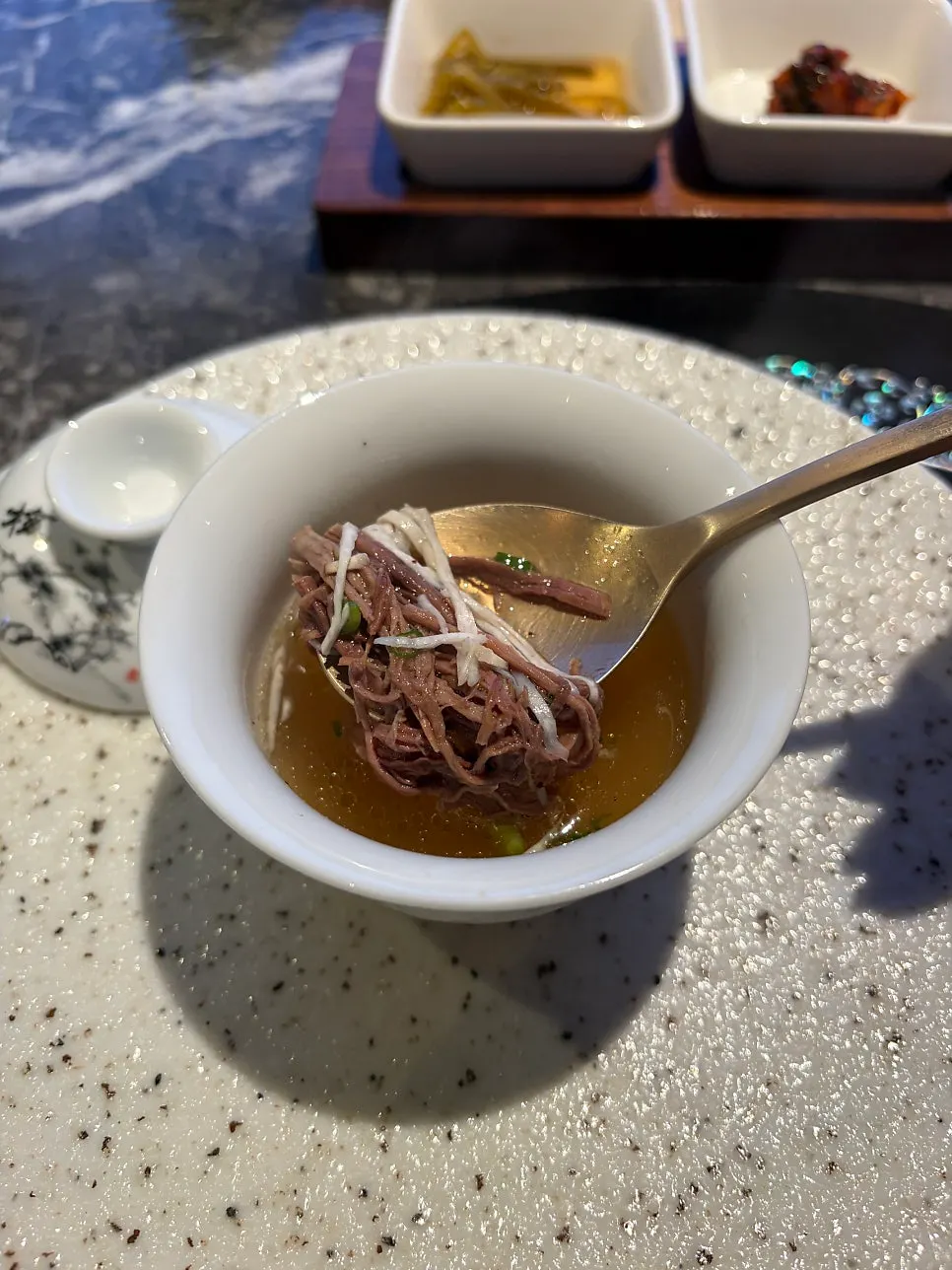 A bowl of Woowine's rich gomtang broth