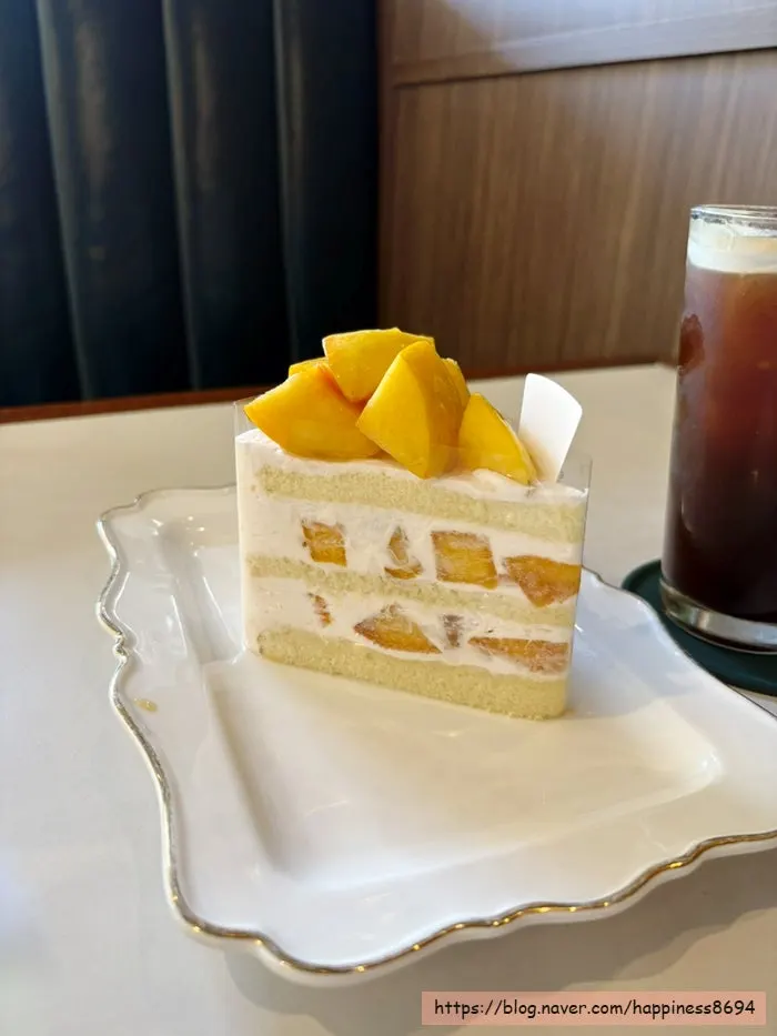 Fruit cream cake paired with an americano