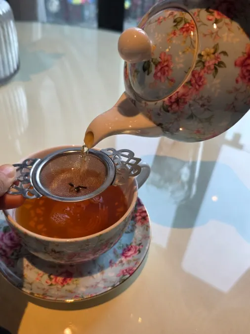 Hot black tea served with a cup of milk