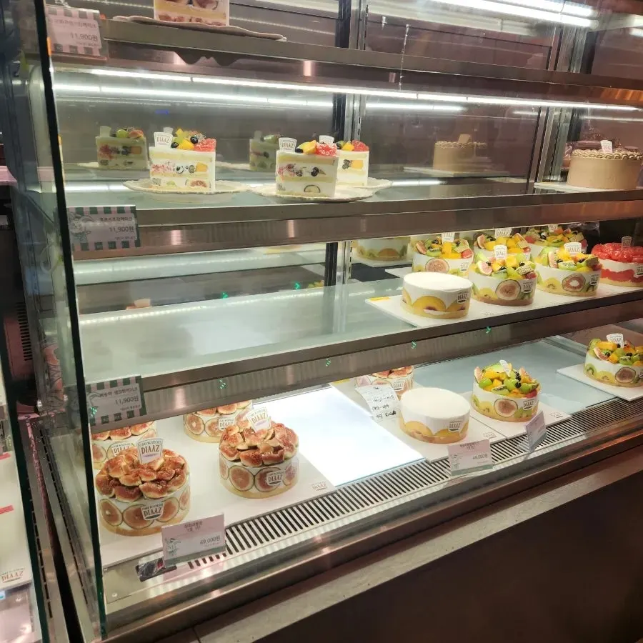 Fresh fruit slice cakes displayed in the entrance showcase