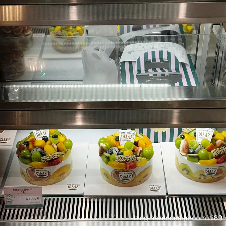Inside the display case with seasonal fruit cakes
