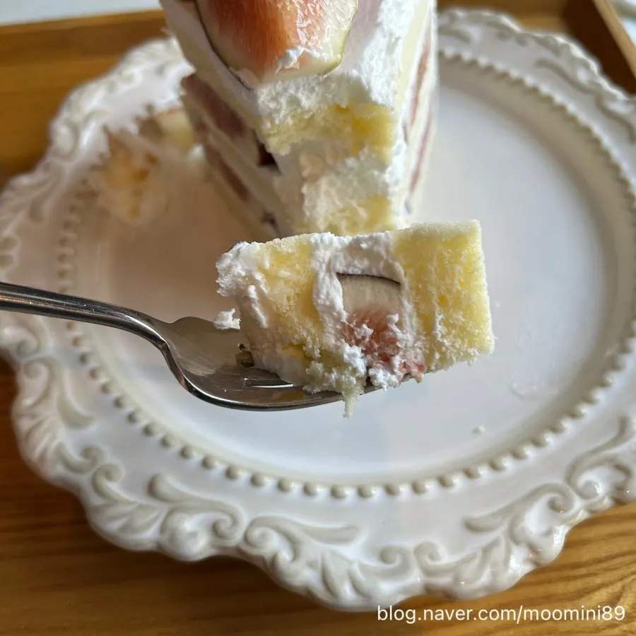 A forkful cut from the fig slice cake