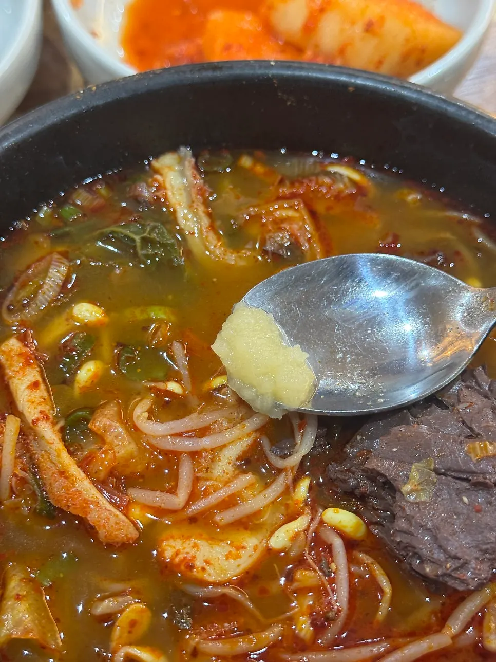 Bean sprouts and ugeoji layered beneath the broth