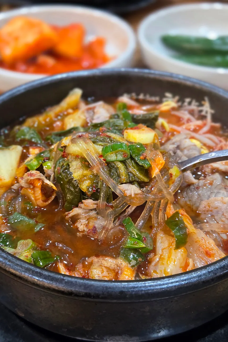 Glass noodles pulled up from the haejangguk