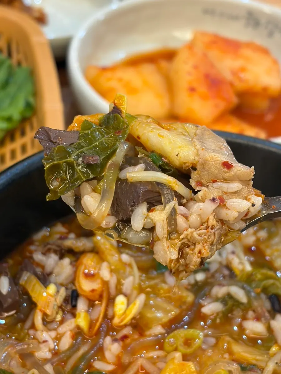 Spicy hangover soup broth with minced garlic stirred in