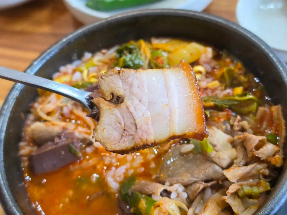Haejangguk topped with a piece of dombe pork