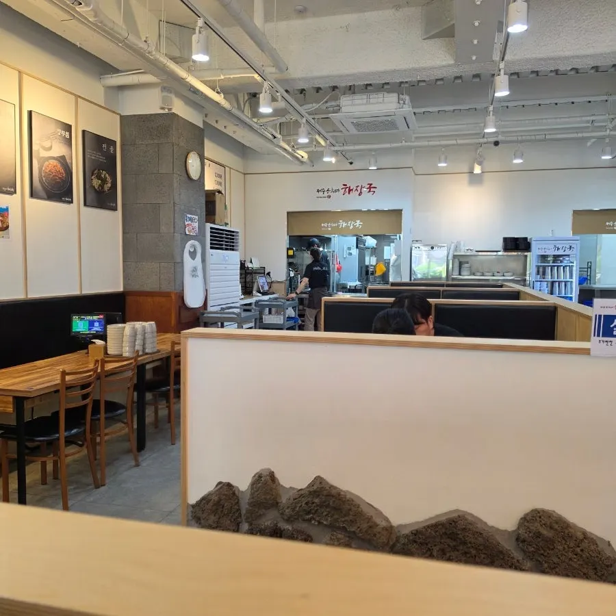 Interior seating with generous spacing between tables