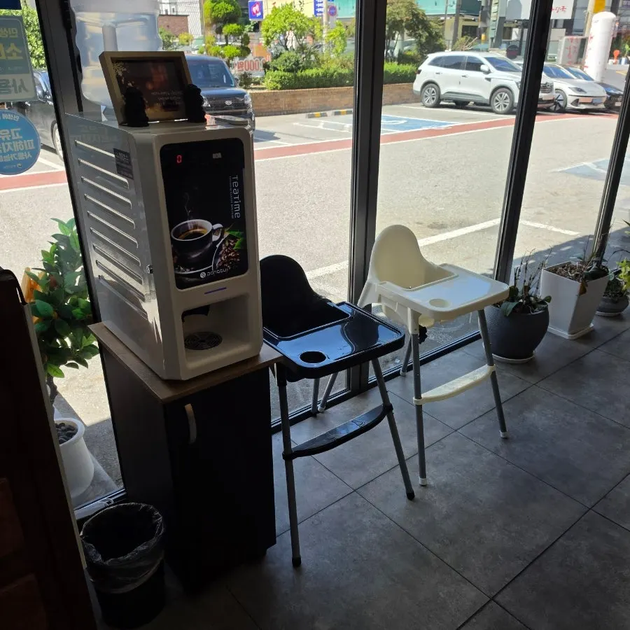 Baby chair and coffee machine set up in the restaurant