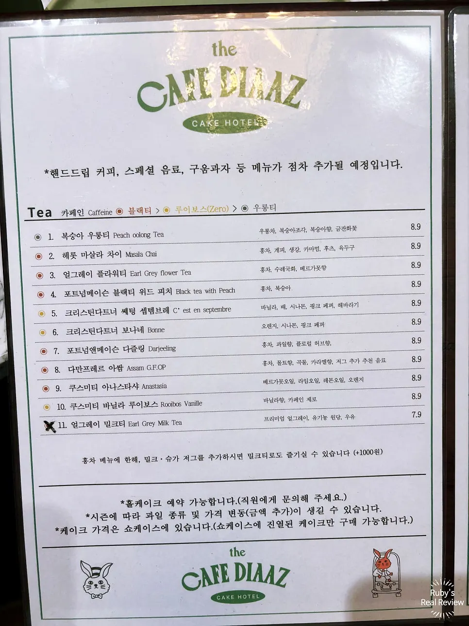 Menu board listing cakes and tea options