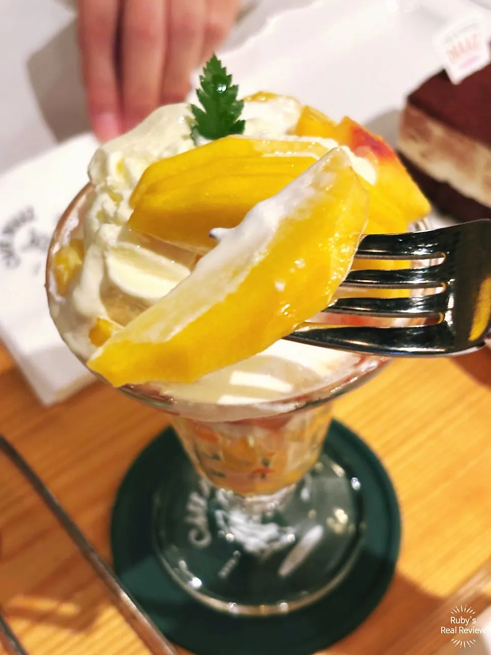 A spoonful of vanilla ice cream and peach