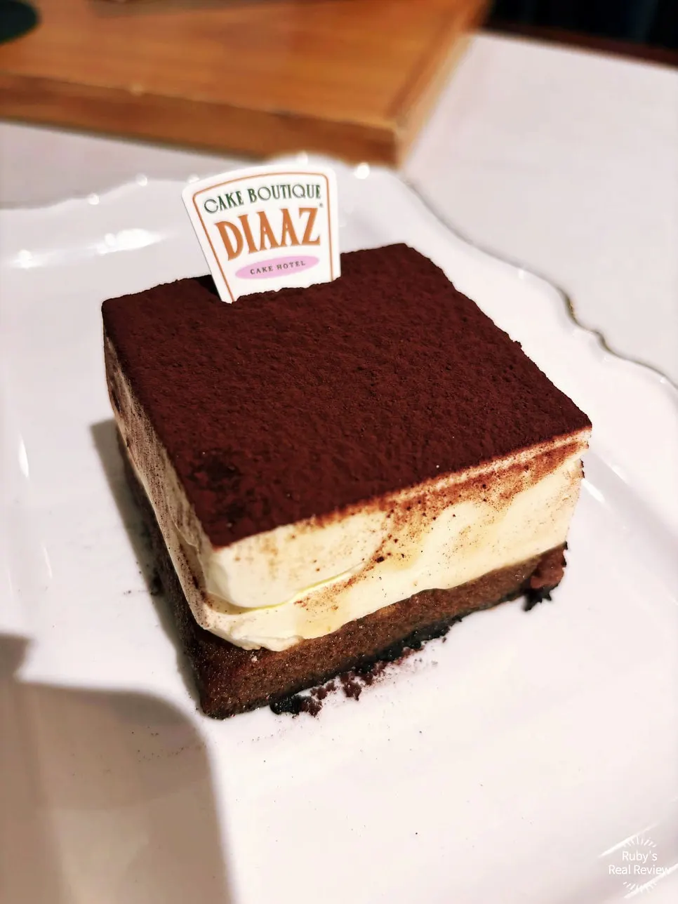 Square cube tiramisu dusted with cocoa powder