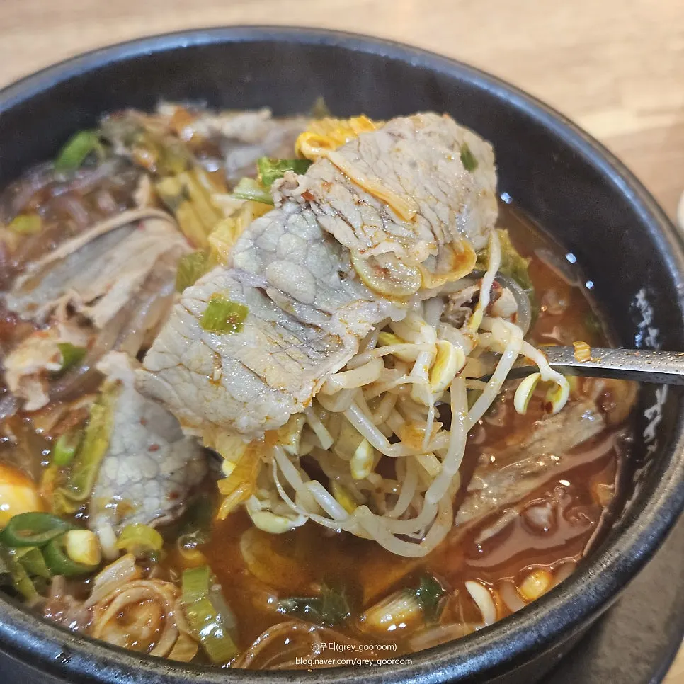 Tender beef lifted out, soaked in broth