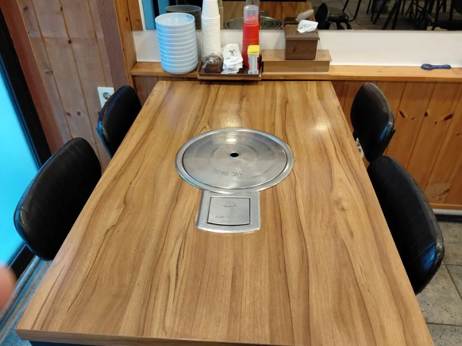 Dining hall with generously spaced tables at Daseon Kalguksu