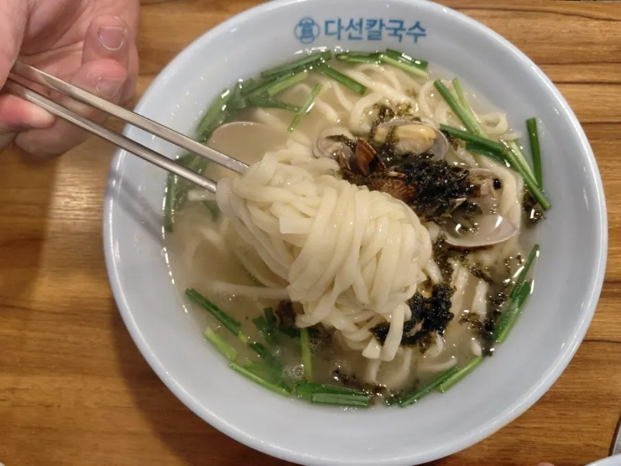 Daseon Kalguksu topped with clams and chives