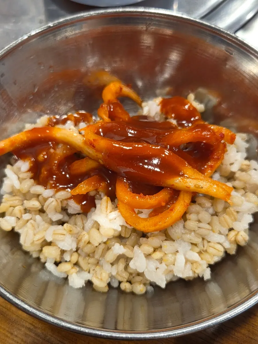 Barley rice mixed with radish salad and gochujang