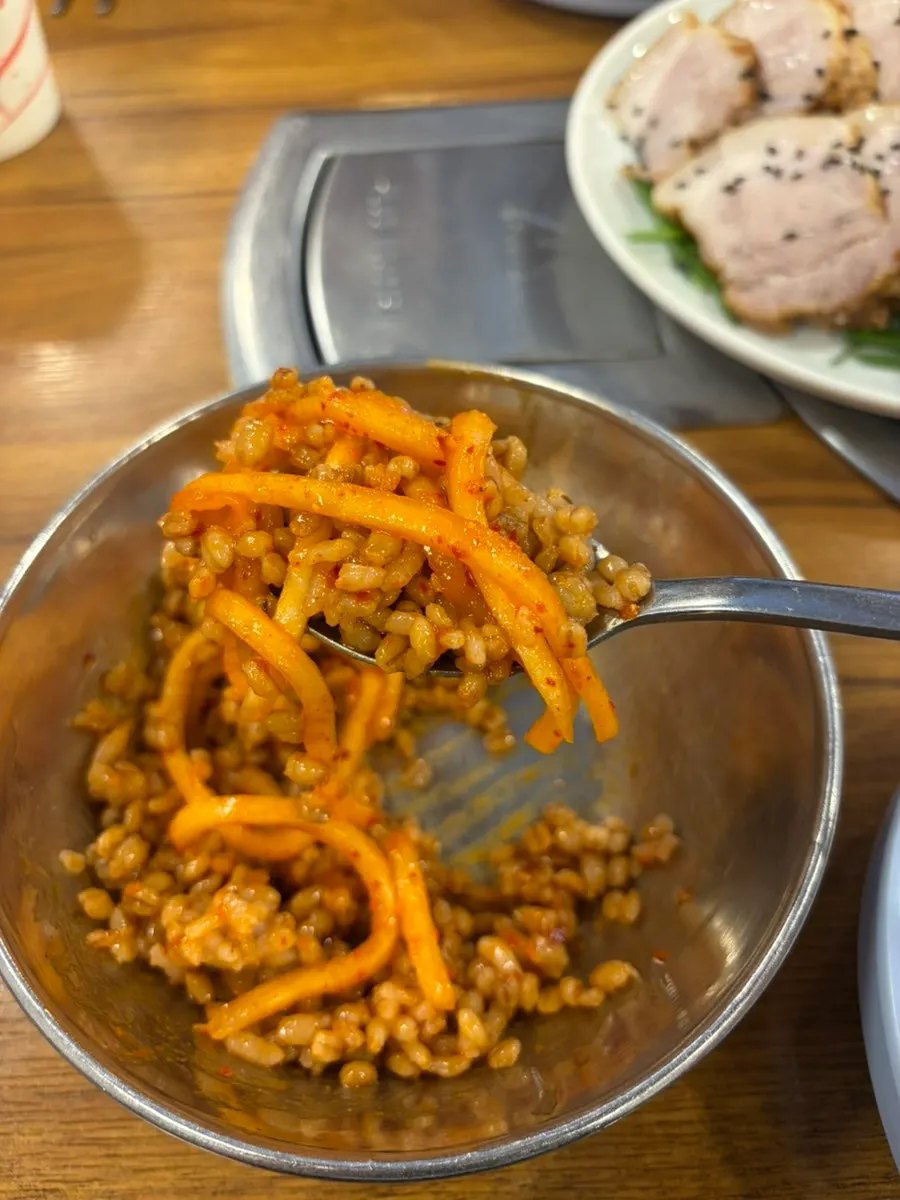 A bowl of barley rice mixed with gochujang