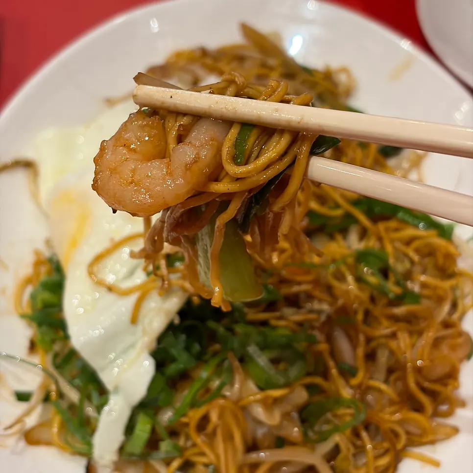 Savory egg noodles topped with egg