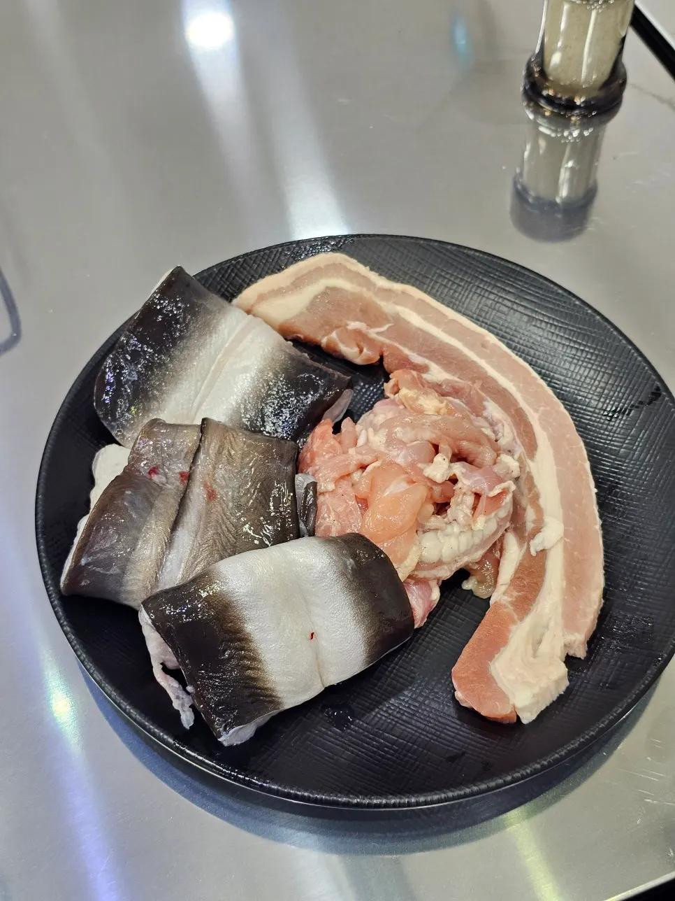 Plate of eel, pork belly and chicken neck for refilling