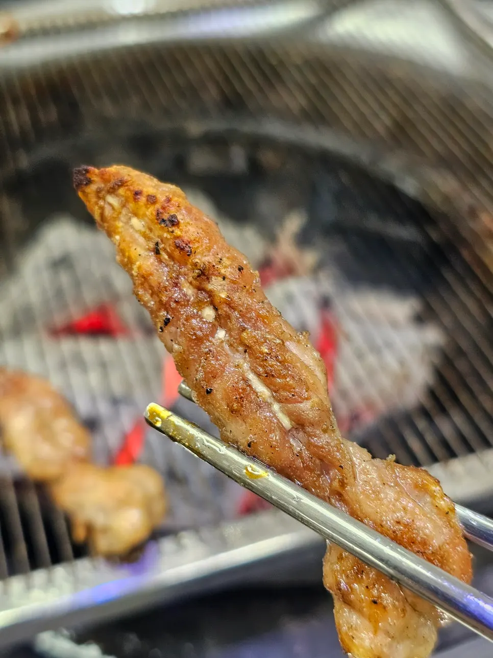 Chicken neck grilled over charcoal