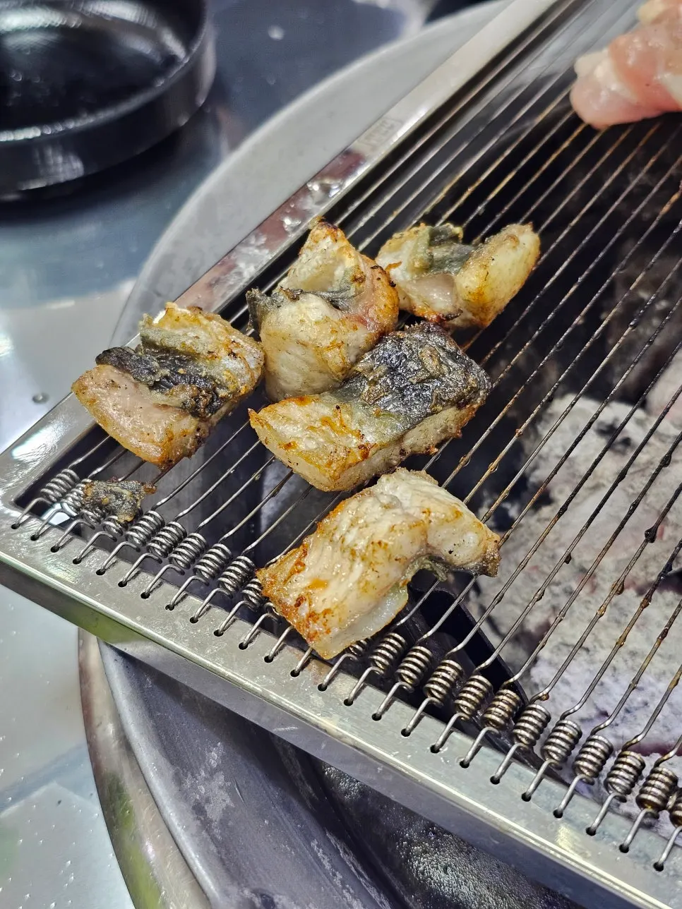Pork belly and chicken neck grilled after three rounds of eel
