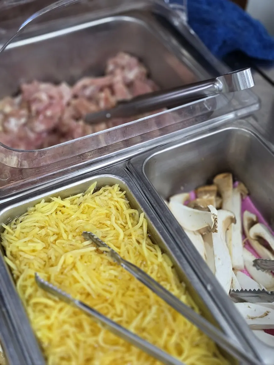 Eel, pork belly and chicken neck meat laid out at the self-serve bar