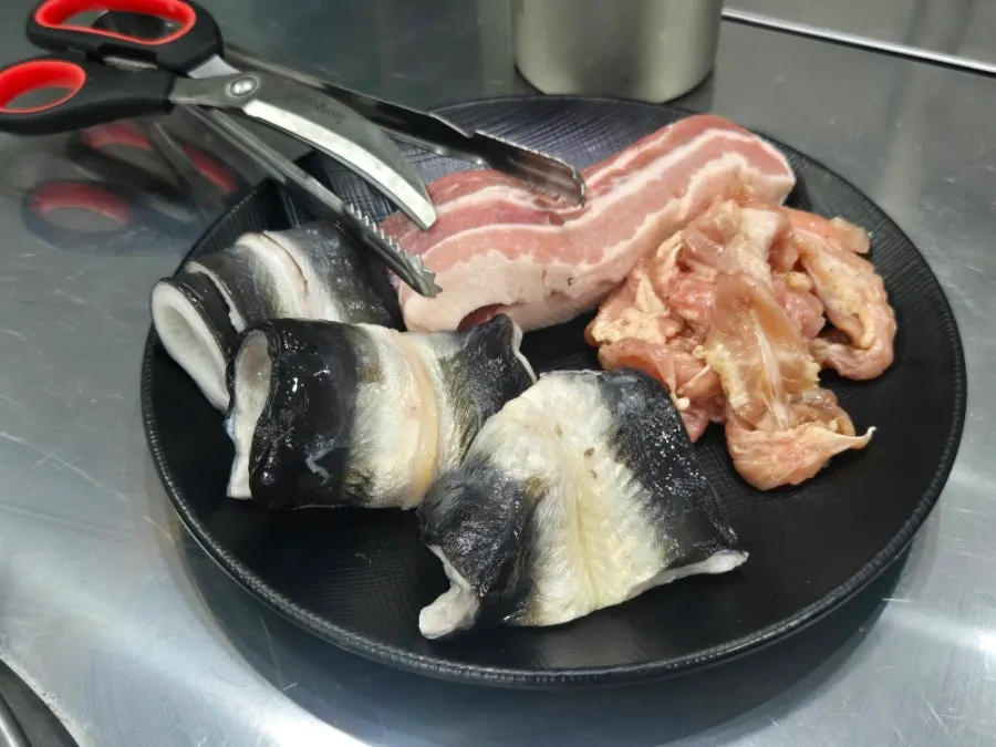 Plate of pork belly, seasoned meat and chicken neck meat