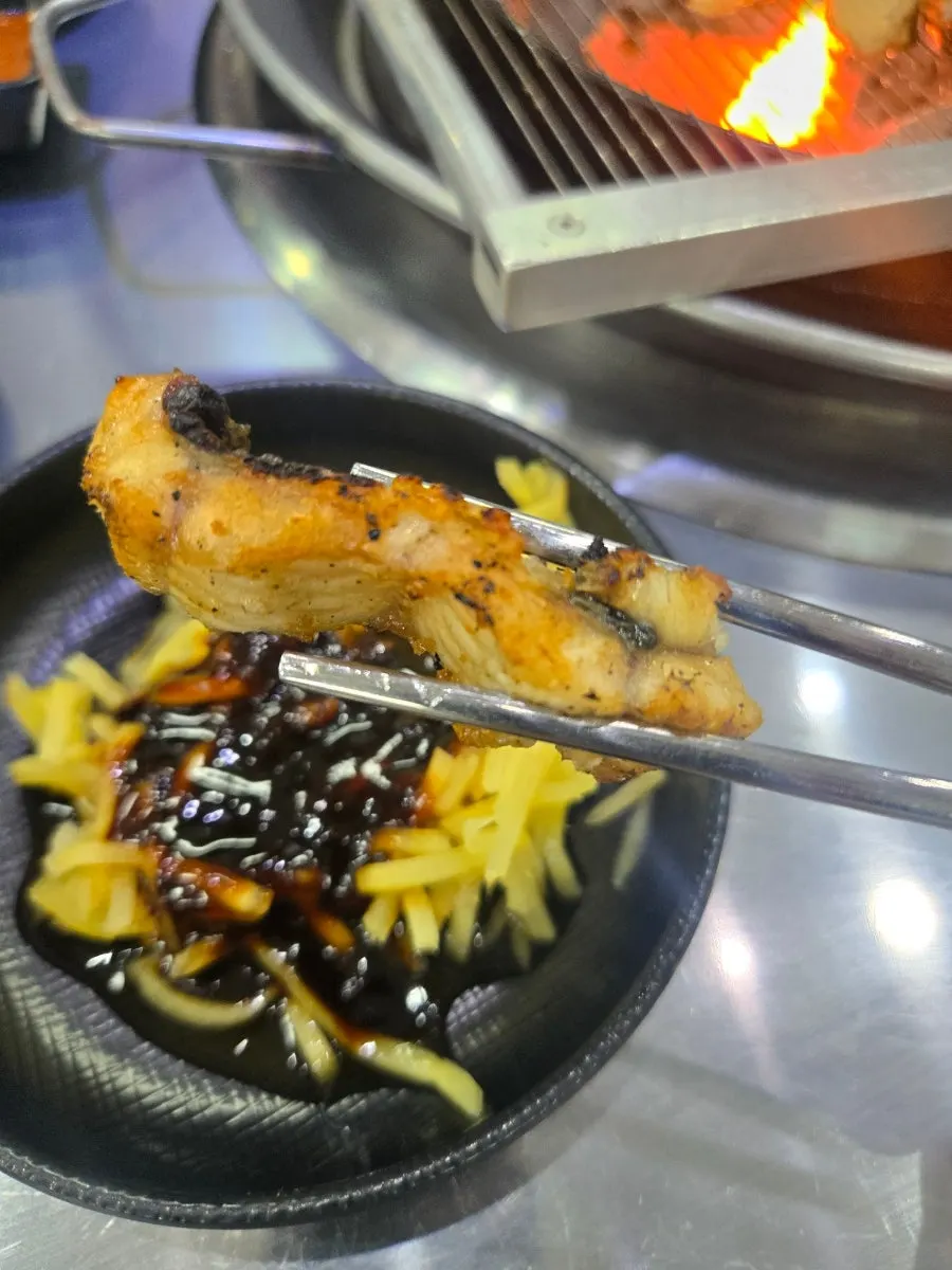 Freshwater eel cooking over charcoal