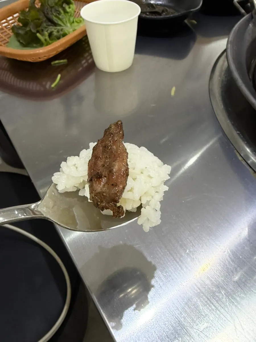 Grilled pork neck with a bowl of rice