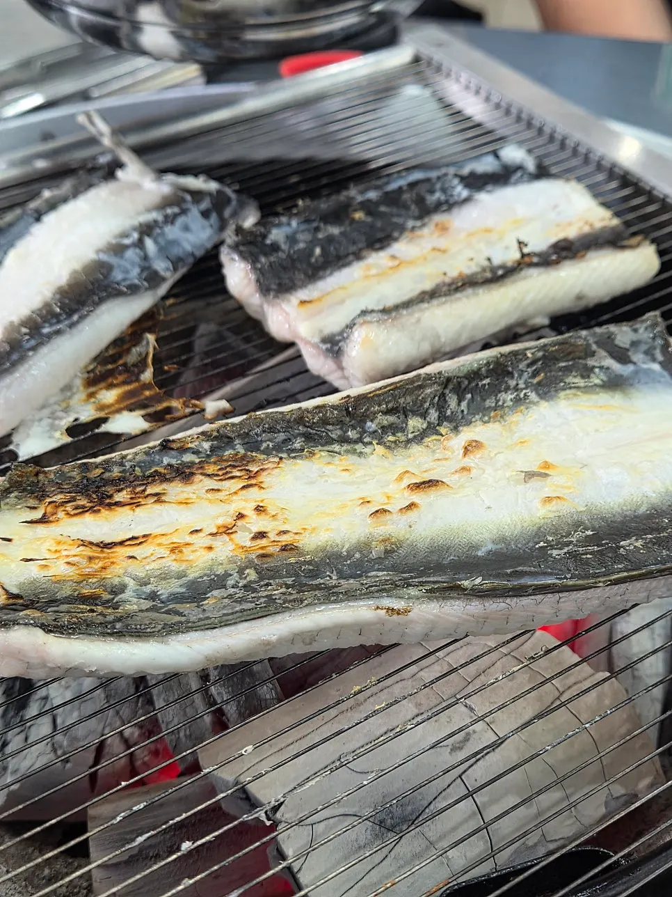 Eel grilling over the charcoal brazier