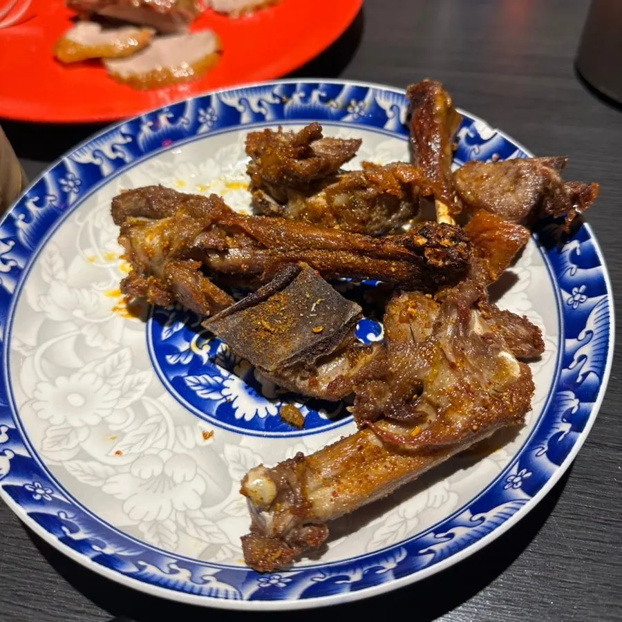 A plate of fried duck bones served after Peking duck