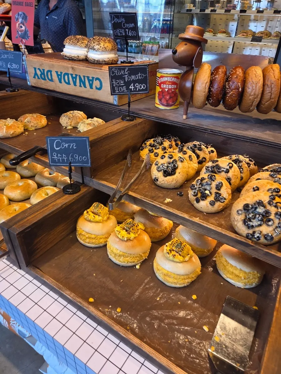 Bagels filled with cream and toppings on display