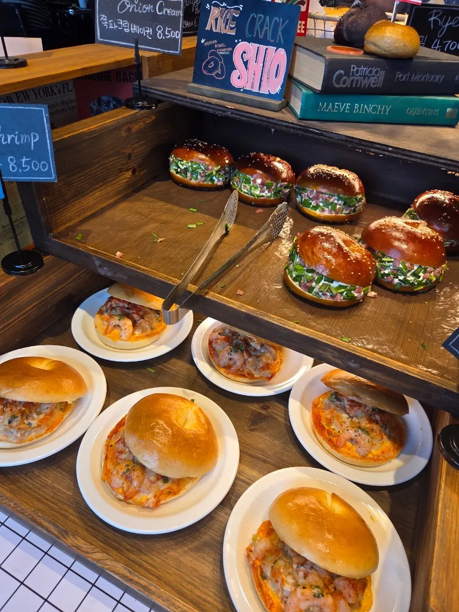 Close-up of basic bagels arranged in the display case