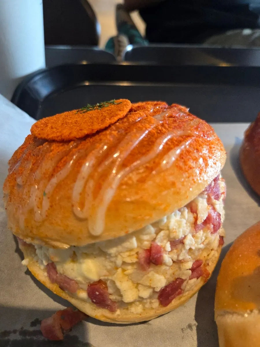 Top of the potato bagel with potato chips and smoked paprika seasoning