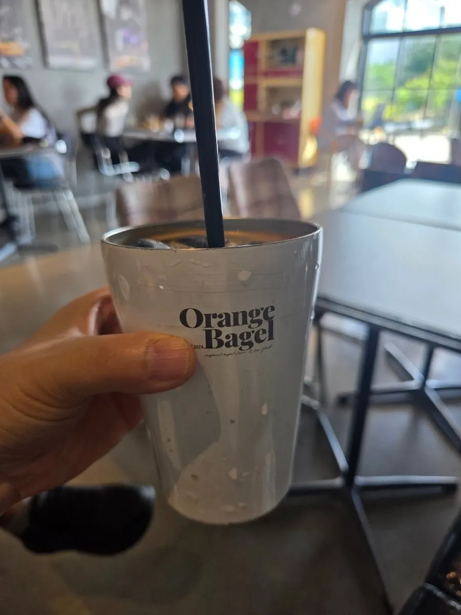 Iced Americano served alongside the bagels