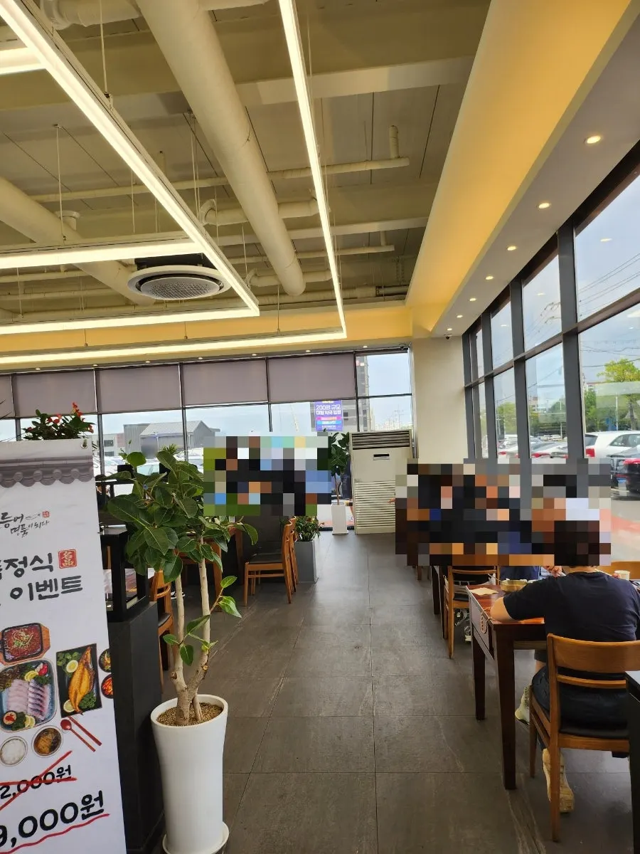 Large dining hall packed with customers