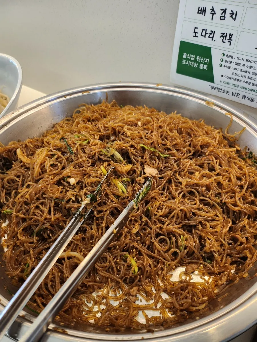 Containers of side dishes at the self-serve corner