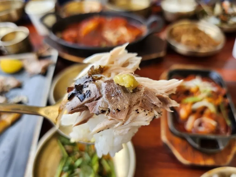 A piece of mackerel placed on white rice