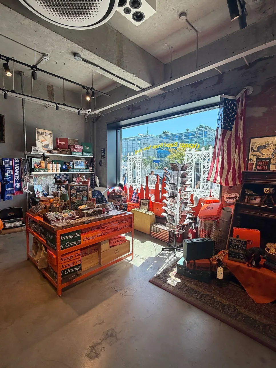 Orange Bagel's large café building and parking area