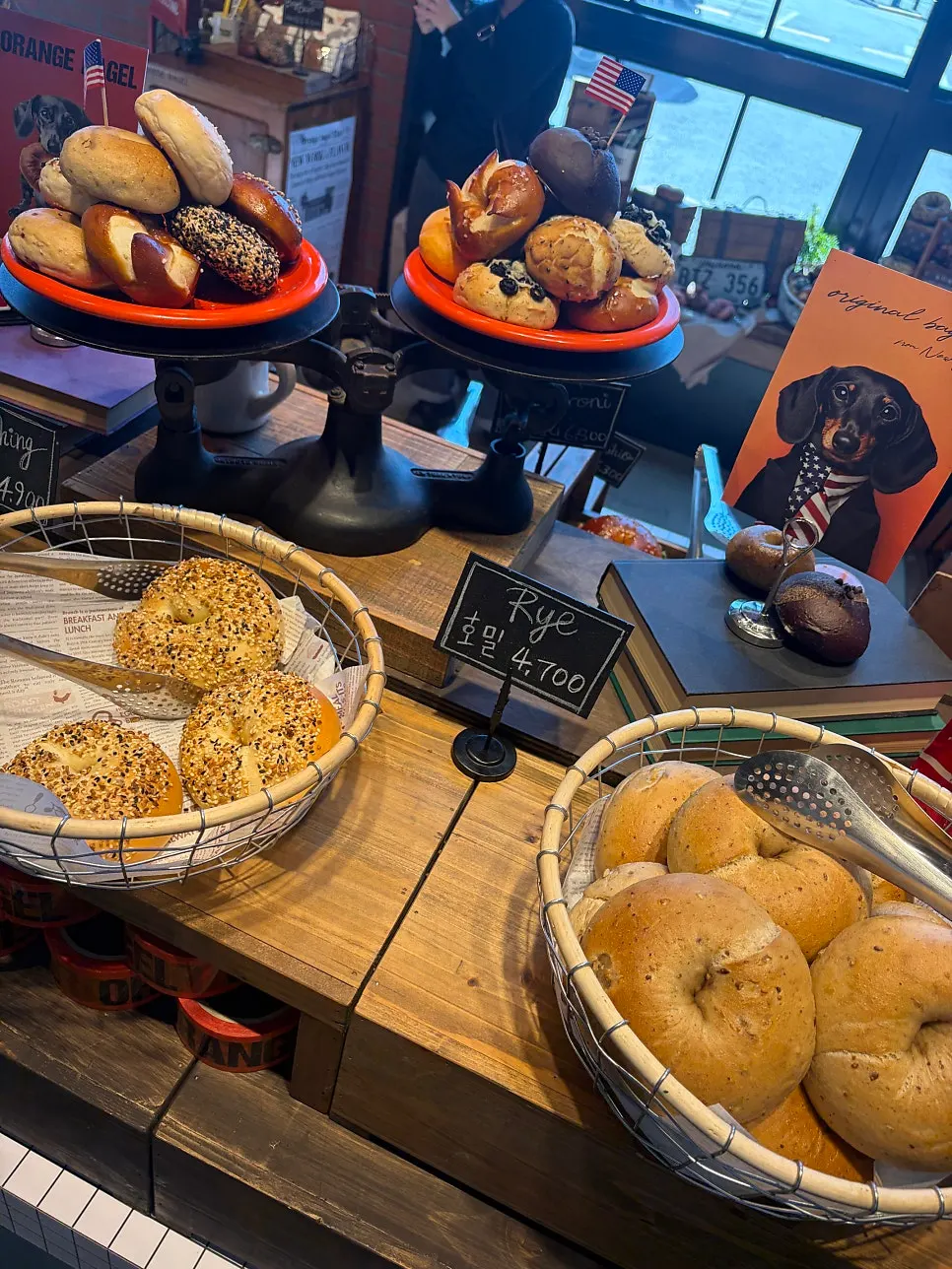 Bagels displayed by variety at Orange Bagel