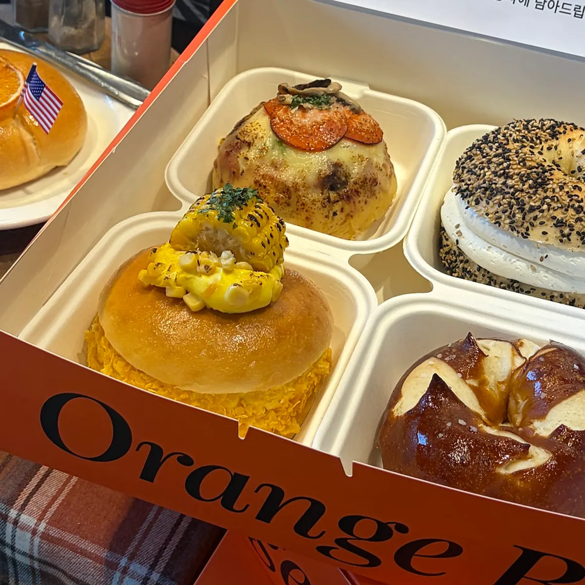 Orange Bagel bagels served alongside an Americano