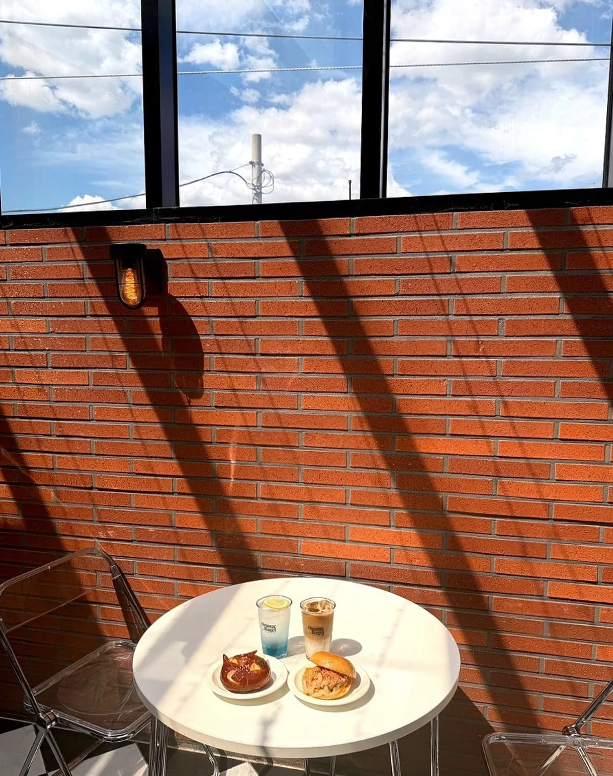 A full spread of bagels and coffee at Orange Bagel, Suwon