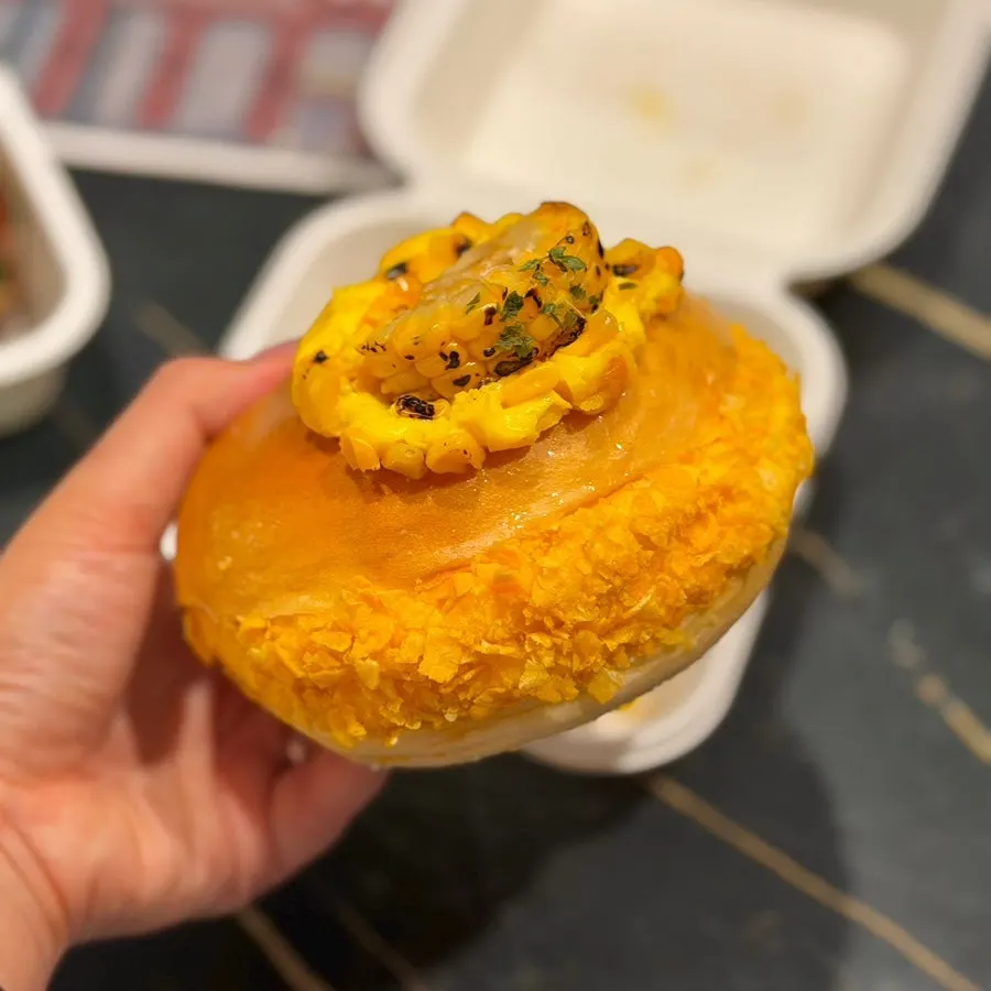Corn bagel topped with corn kernels