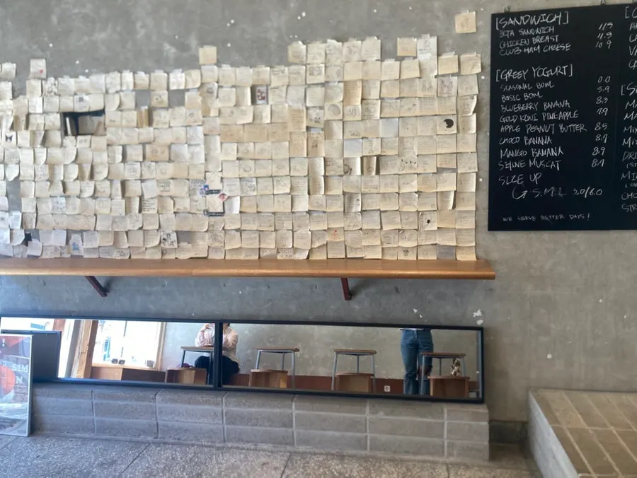 Outside the café with a sandwich sign