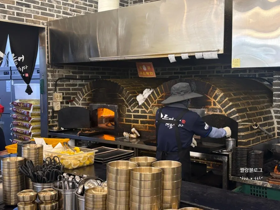 Large wood-fired fish-grilling oven inside the restaurant