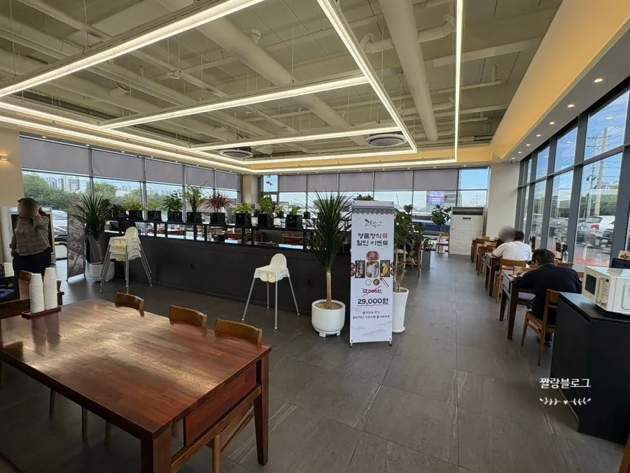 Spacious dining hall interior with potted plants