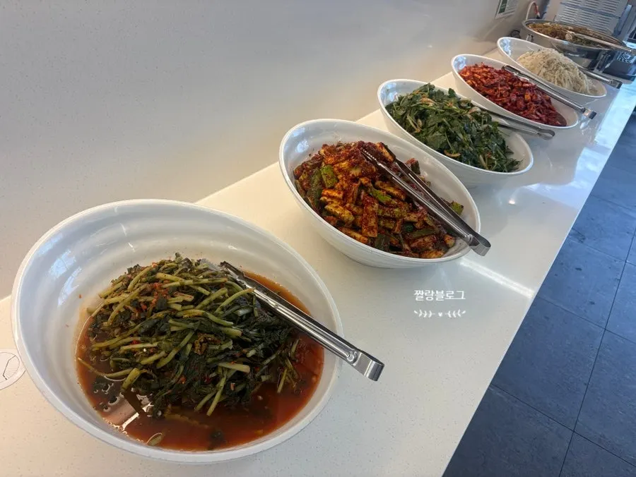 Customers filling their plates at the self-bar