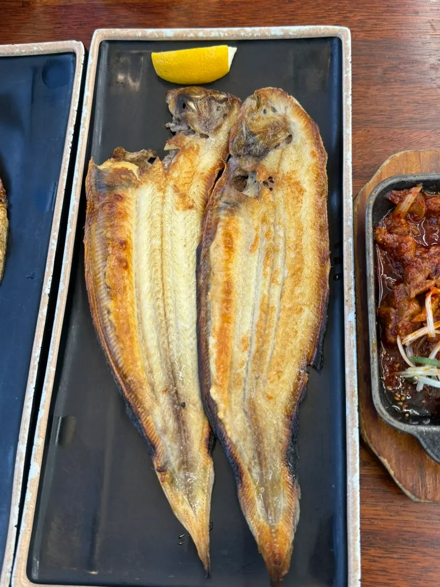 Grilled mackerel with the flesh flaked apart