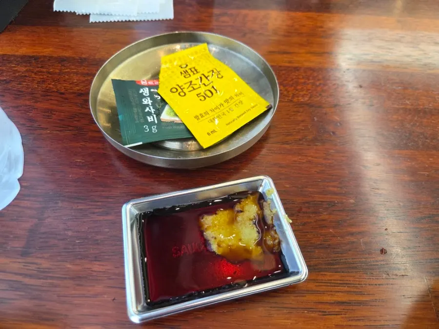 Tear-open packets of wasabi and soy sauce